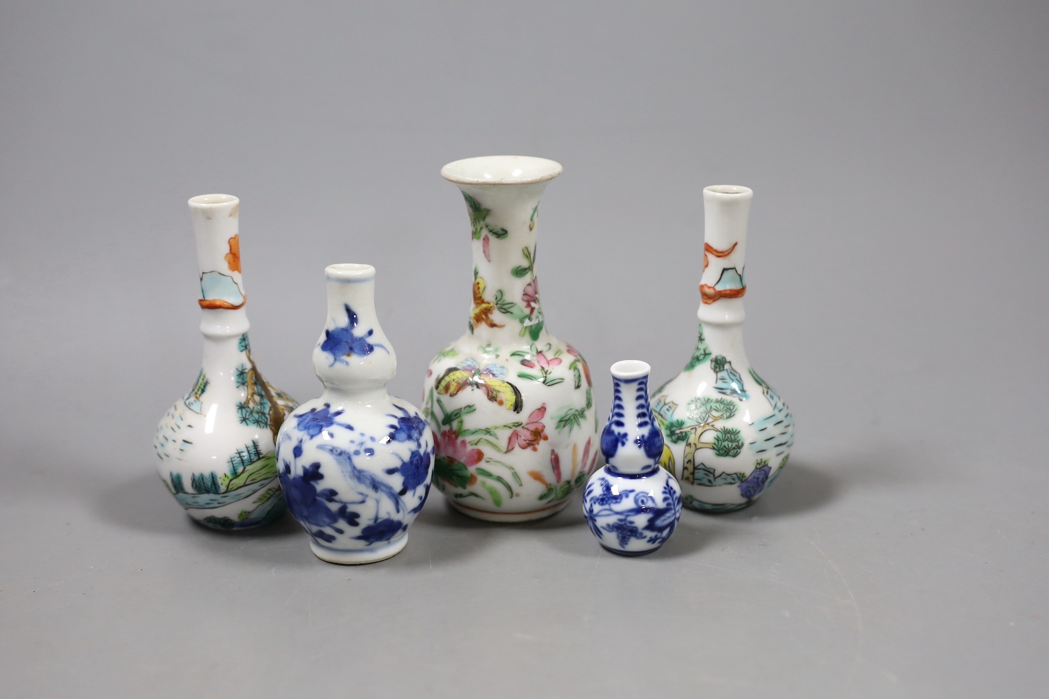 A group of Chinese miniature porcelain bottle vase, 19th/20th century and a Meissen miniature onion pattern vase. Tallest 12cm